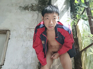 Super Asian boy lies in abandoned factory area, lying in sink, masturbating, ejaculating, moaning, and swallowing liquid