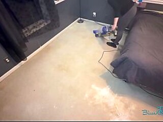 Housewife with long hair and tattoos cleans while wearing glasses